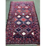 An antique Northwest Persian rug with geometric pattern 220 x 127 cm