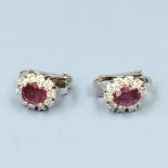Pair of 18ct white gold ruby & diamond cluster earrings