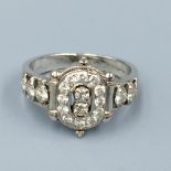 18ct White gold diamond cluster ring flanked with diamond shoulders size I 1/2