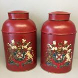 Pair of red oval tea cans decorated with a coat of arms 45 cm h