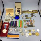 Small collection of British & Canadian medals, military buttons, badges etc