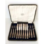 Set of silver knives & forks in original case marked Harrods London SW