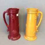 Pair of interesting pottery jugs decorated with circular motif 27 cm, small metallic painted jug