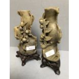 Pair of Chinese soap stone vases on hard wood stand 21.5cm
