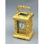 Rococo style miniature 8 day carriage clock with key