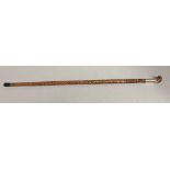 Indonesian walking stick with parrot head handle, surmounting a white metal band 88cm