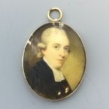 C18th Oval miniature 'Parson Wearing A Wig' 4 x 3.5 cm in yellow metal frame