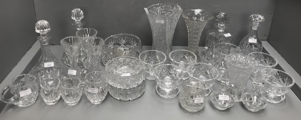 Qty of cut glass, 4 decanters, glass jugs, ash trays, vases, bowls etc