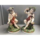 Pair of porcelain cherubic figures 50 cm