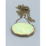 Opal pendant set in white precious metal possibly platinum