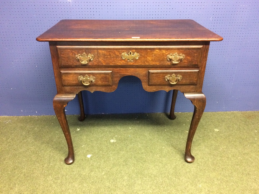 Oak lowboy with 1 long drawer over 2 small side drawers 86 x 53 cm