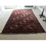 Middle Eastern carpet with blue, cream & brown on maroon ground 315 x 202 cm