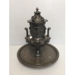 Ornate metal centre piece, possibly a tobacco jar on a circular base. 38 h cm 34 cm d