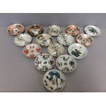 15 Chinese saucers decorated in orange & green