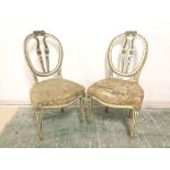 Pair of painted French bedroom chairs with serpentine seats