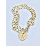 9ct gold locket charm on unmarked yellow metal curb double bracelet 24g