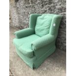 Armchair upholstered in green fabric & yellow pattern