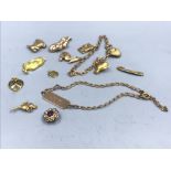 9ct gold charm bracelet with numerous 9ct charms 28.1g gross