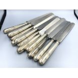 Set of 12 Georgian silver handled table knives with replacement blades