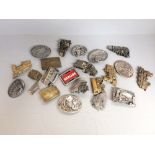 Qty of metal belt buckles mainly depicting modes of transport