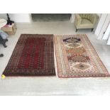 Machine made Bokhara rug in reds & browns 187 x 125 cm & handmade rug in pastel colours (worn) 190 x