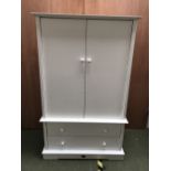Modern white cupboard with hanging rail above 2 drawers 168 cm High