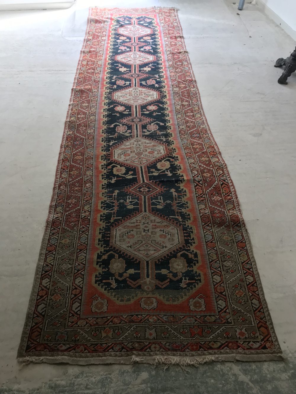 C20th machine made wool runner with geometric pattern, flowers & creatures on a blue & orange ground - Image 4 of 4