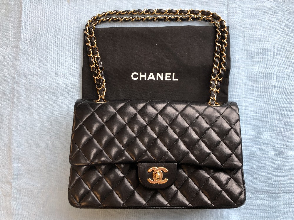 Chanel black quilted leather Classic bag, gold tone hardwear, burgundy leather interior, dust