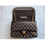 Chanel black quilted leather Classic bag, gold tone hardwear, burgundy leather interior, dust