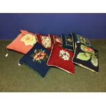 8 Tapestry cushions in a range of colours depicting flowers with fabric backs