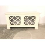 Cream painted radiator cover with cross design 164 cm