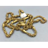 Antique yellow coloured metal long guard chain