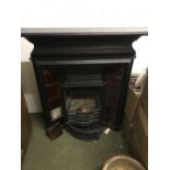 Cast iron fire surround including fire grate, maroon ceramic tiles on either side 106 x 122 cm