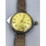 Early C20th gentlemans wrist watch converted pocket watch, unmarked white metal case & unmarked