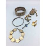 Collection of silver & white metal items to include chased bangle, locket etc