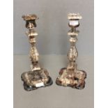 Pair of white metal candle sticks with floral decoration 30.5cm