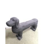 Black painted metallic garden seat modelled as a standing dog 118 cm L