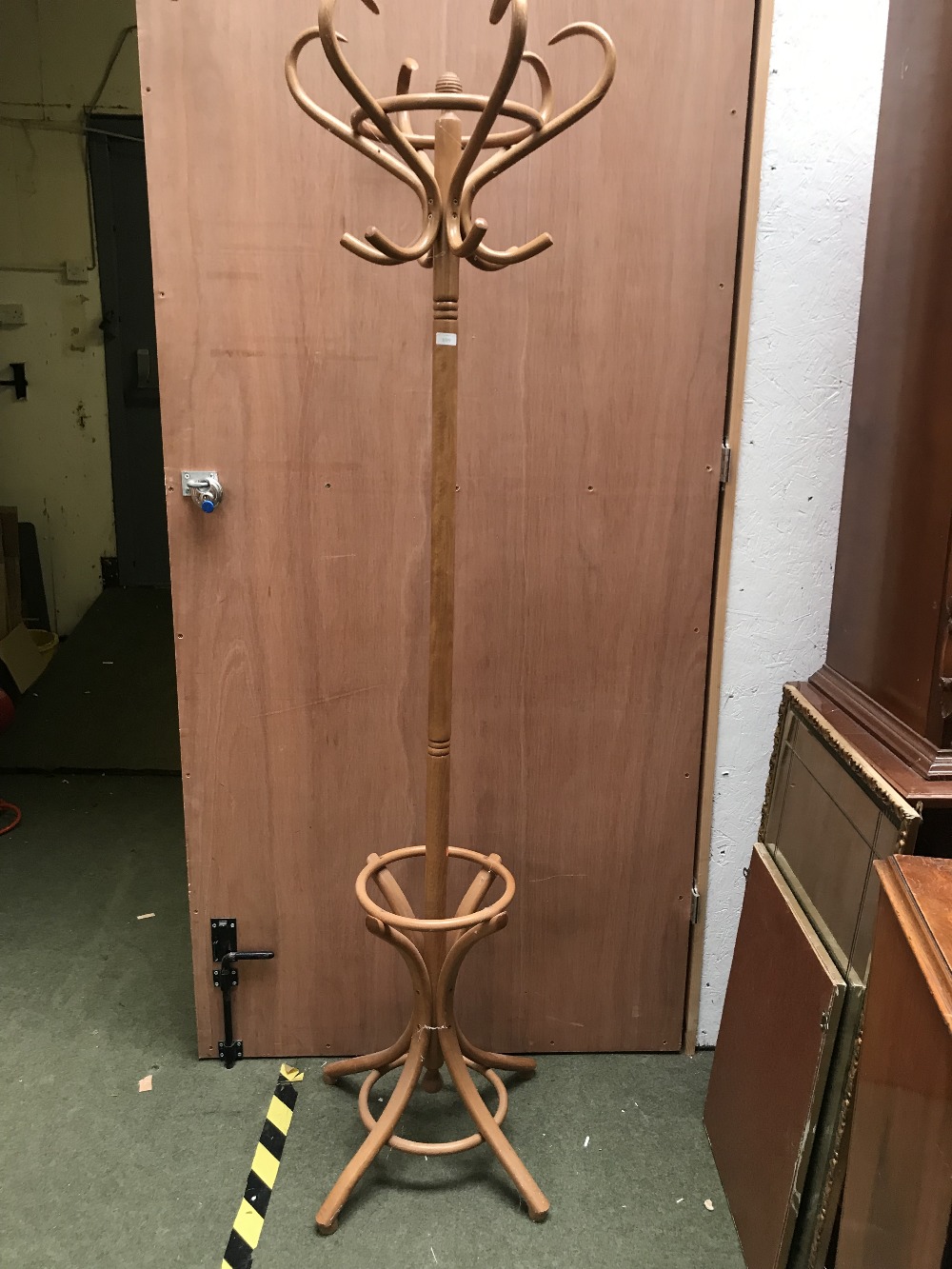 Modern bentwood coat/hat stand, with central scrolling support