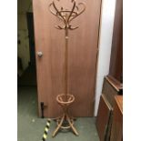Modern bentwood coat/hat stand, with central scrolling support