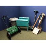 Selection of garden equipment to include, seeder, blue wooden saw horses, pick, shovel &