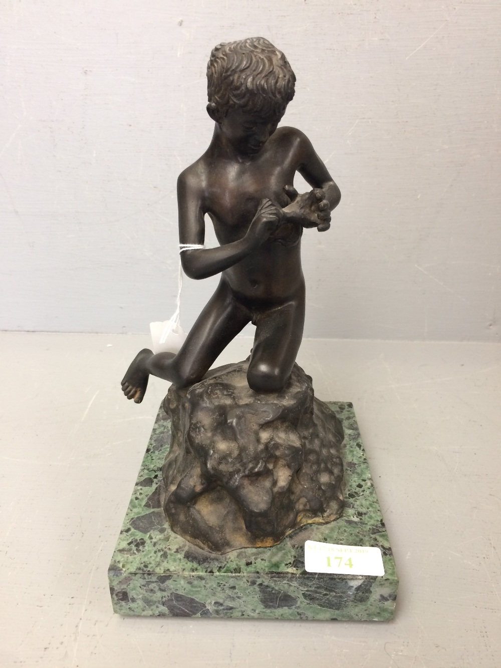 C20th bronze of a boy extracting a thorn from his hand, signed G Vollaro, on a marble base 25.5 cm h