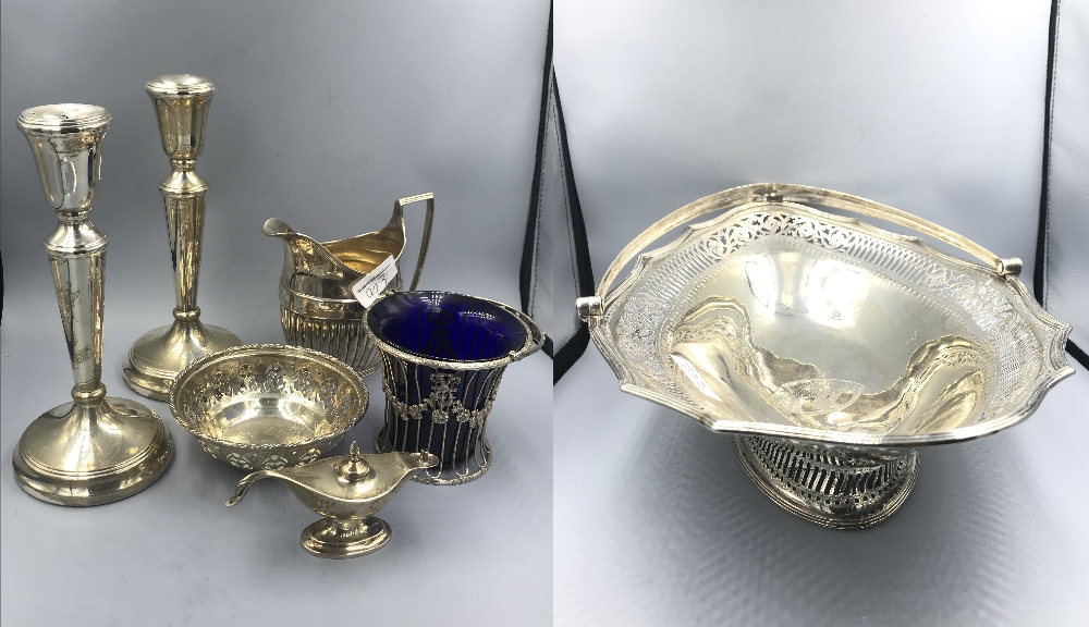 Collection of electroplated wares to include pair of candlesticks, swing handled basket & other