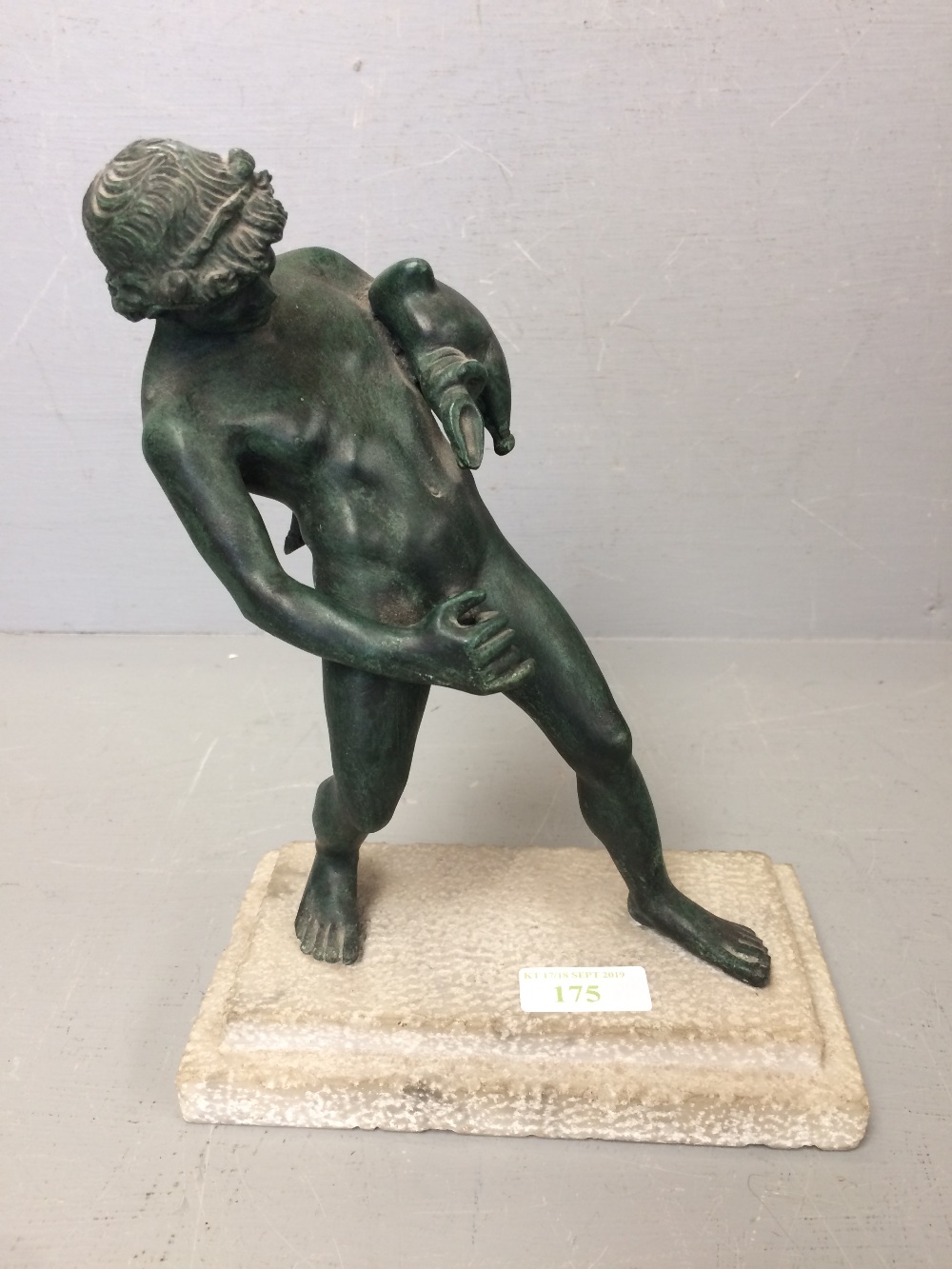 Late C20th bronze of a boy carrying water 25cm