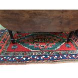 Small red rug with blue borders 80 X 152 cm