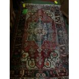 Small rug with blue, red & green border & blue central medallion 125 X 196 cm