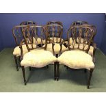 Set of 8 (6 & 2) mahogany dining chairs with curving & decorative stick backs and overstuffed
