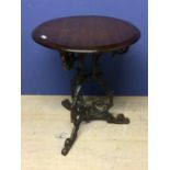 Mahogany circular tavern table with cast iron base 57 cm dia