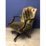 Green leather button backed library arm chair