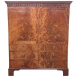 A good quality C18th flame mahogany and string inlaid two door wardrobe, the top dentil cornice with