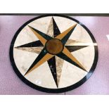 A Caracas inlaid marble table top of geometric design